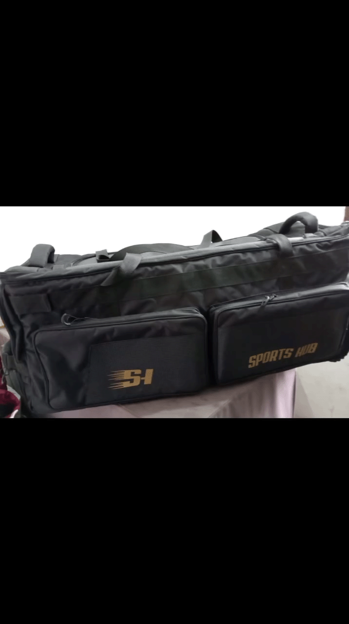 Sports Hub Pro Edition 39-inch professional cricket wheelie bag in black and gold featuring a retractable trolley handle and heavy-duty tractor wheels.